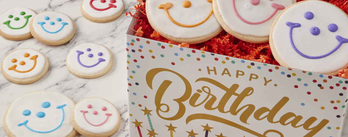 happy birthday gift box with smiley cookies
