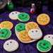 A variety pack of Halloween cookies with Monster Cookies, Pumpkin Cookies, and Mummy Cookies